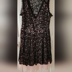 Black lace over pink under dress